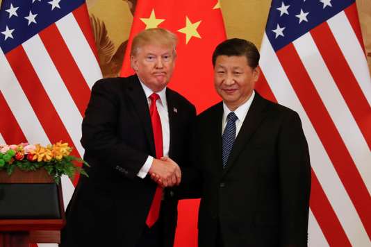 U.S. President Donald Trump and China's President Xi Jinping shake hands after making joint statements at the Great Hall of the People in Beijing